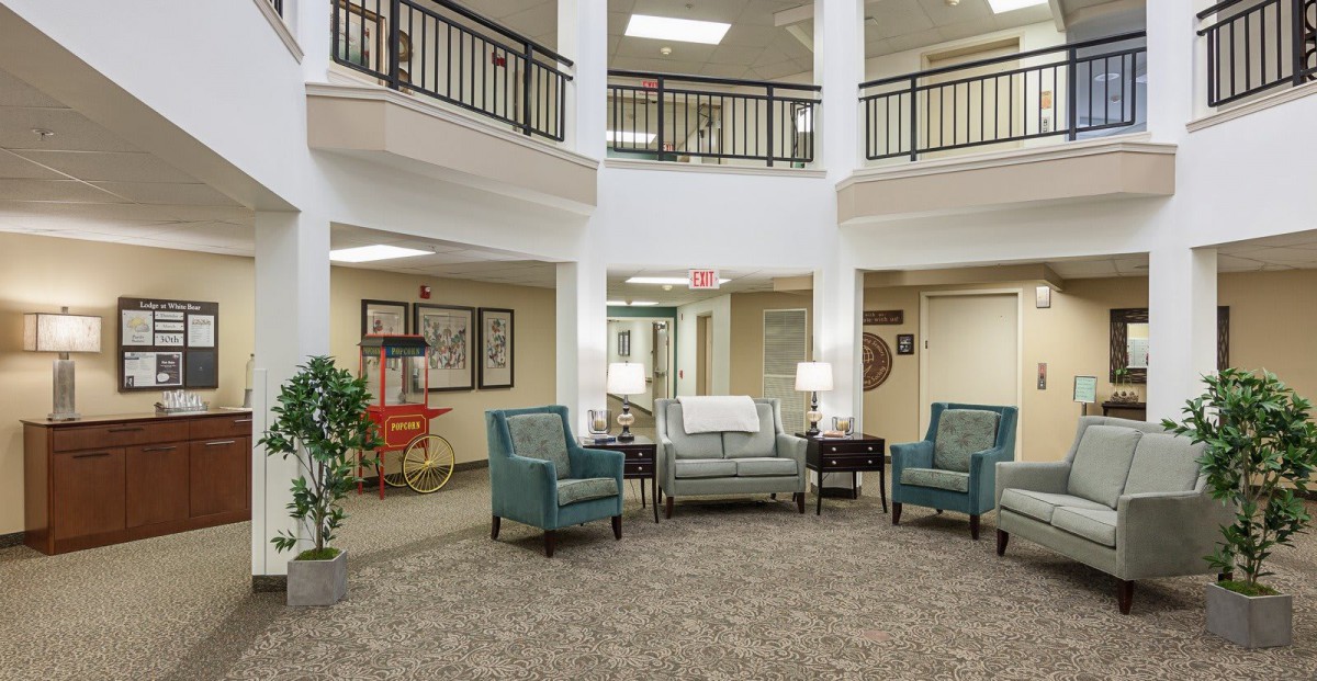 A cozy lobby with comfortable seating and warm lighting.