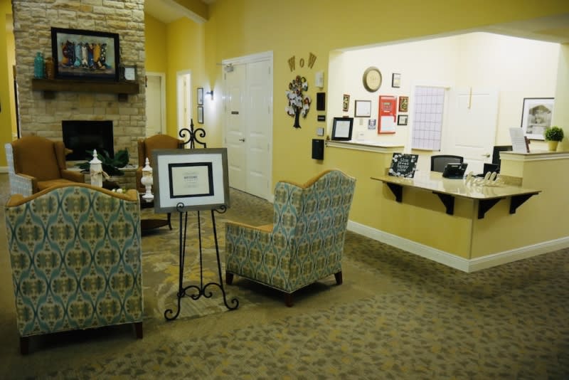 A cozy living room with comfortable chairs and warm decor.