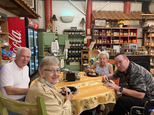 A group of four enjoying a meal together in a cozy restaurant setting.