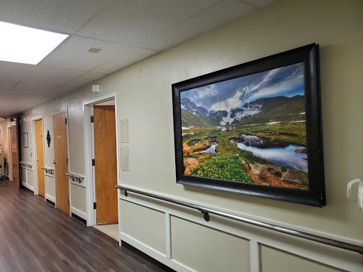 A serene landscape photograph hangs on a corridor wall, adding a touch of nature to the interior.