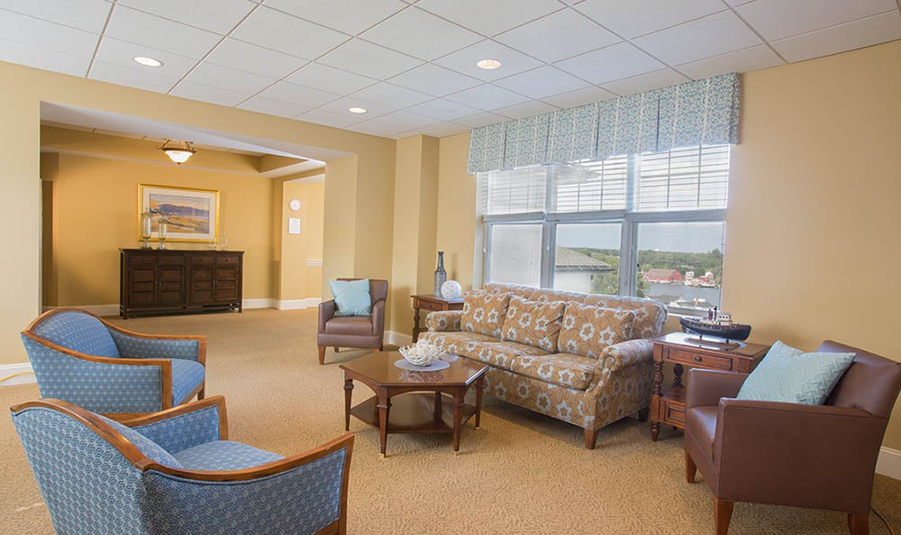 A cozy living room with comfortable seating and a large window.