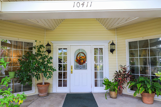 The welcoming entrance of a charming home with decorative plants.
