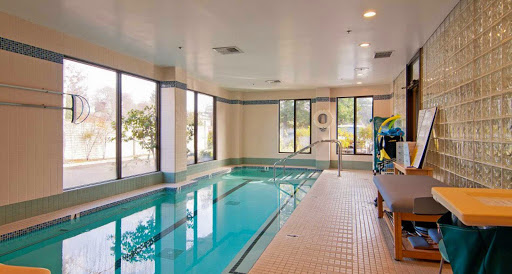 A serene indoor swimming pool offering a tranquil space for relaxation and exercise.