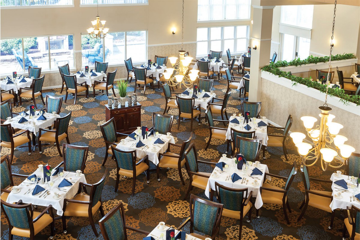 An elegant dining area with neatly arranged tables and chairs in a restaurant.