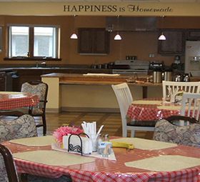 A cozy dining area with checkered tablecloths, set in a restaurant.