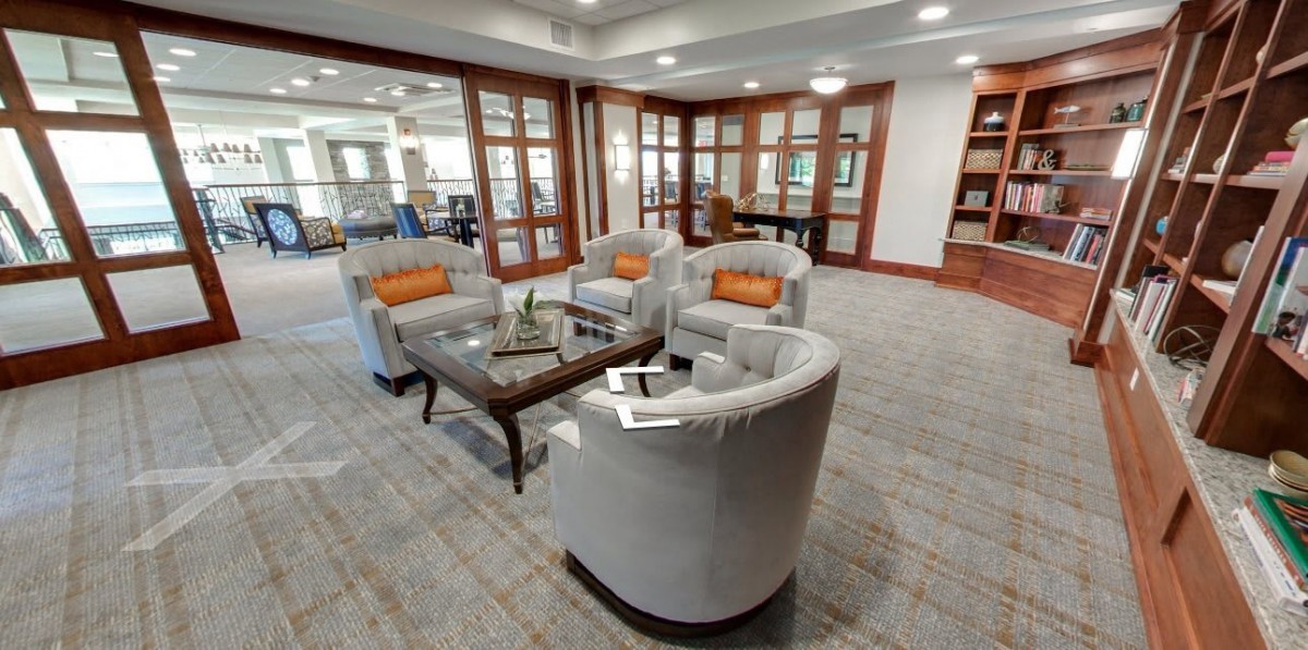A modern lounge with comfortable seating and a coffee table.