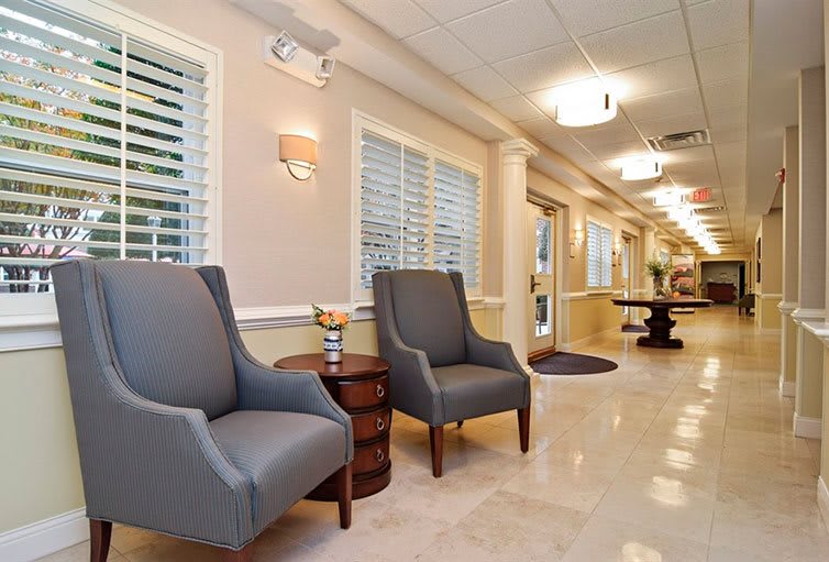 A well-lit lobby with comfortable seating and elegant decor.