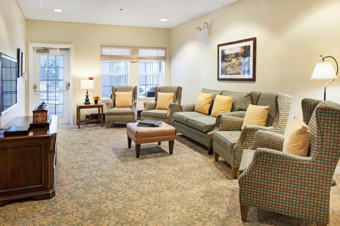A cozy living room with comfortable seating and soft lighting.