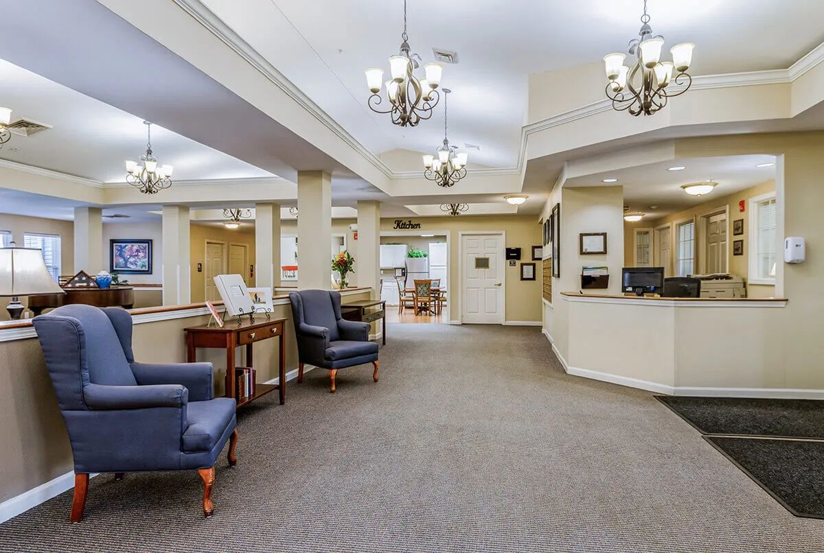 A spacious lobby area featuring comfortable seating and elegant chandeliers.