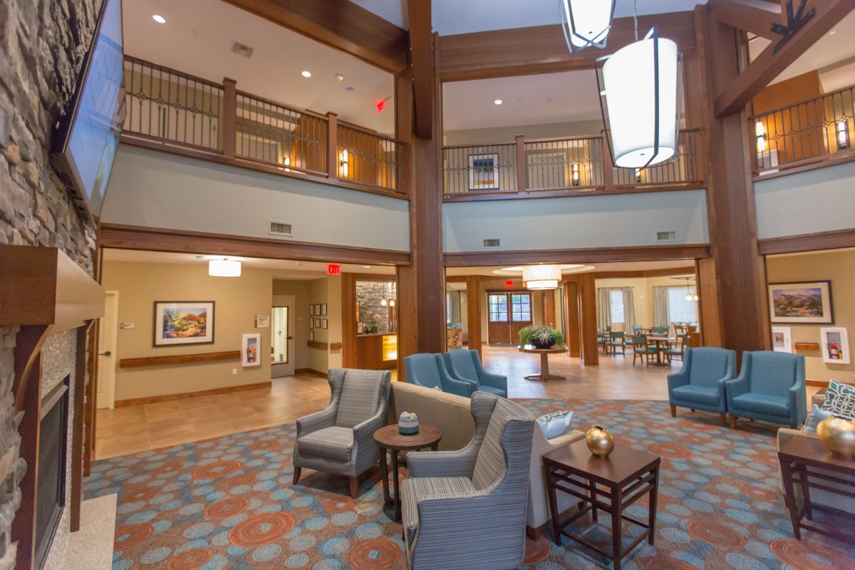 A spacious and modern hotel lobby with comfortable seating and stylish lighting.