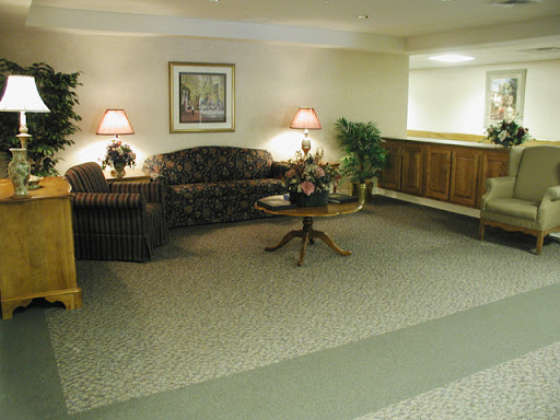 A cozy lobby area featuring comfortable seating and warm lighting.