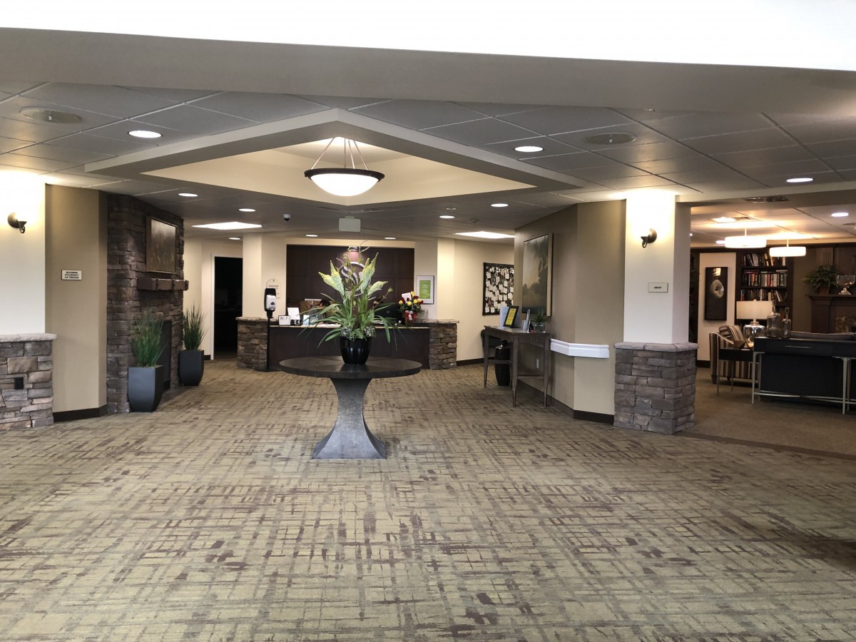 A welcoming reception area with elegant interior decor and a central floral arrangement.