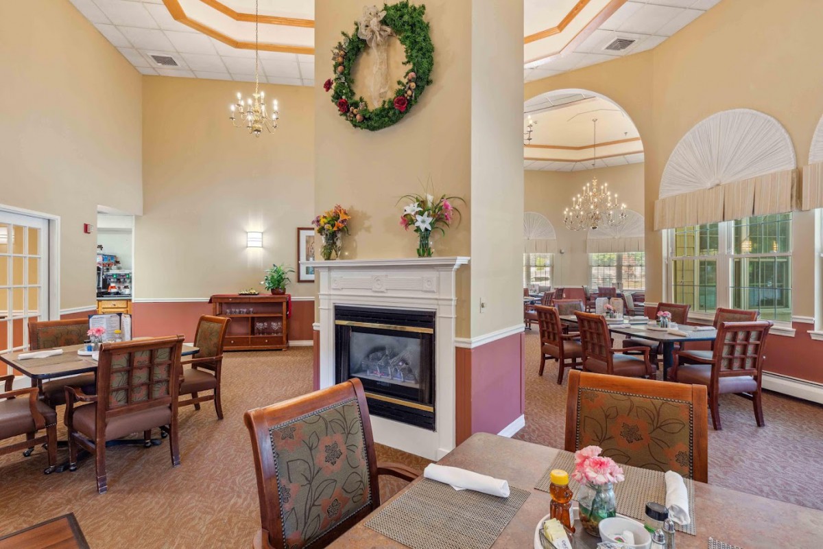 An elegant dining area featuring a cozy fireplace and stylish decor.