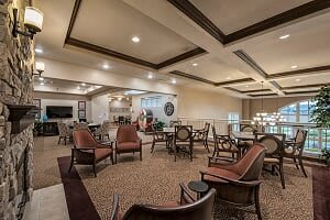 A spacious and well-lit lounge area with comfortable seating and elegant decor.