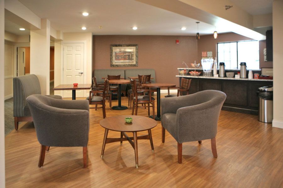 A cozy cafe with modern seating arrangements and a warm ambiance.