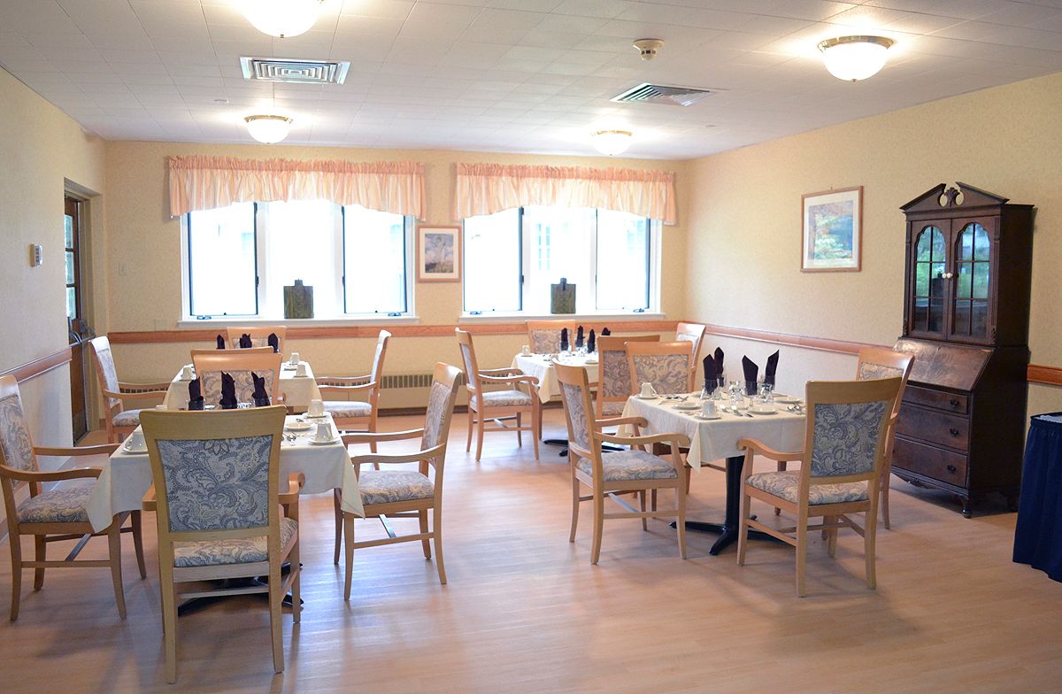 A cozy restaurant dining area with neatly arranged tables and chairs.
