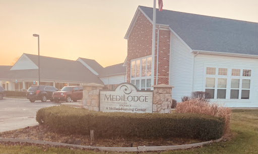 Entrance to a residential community during sunset.