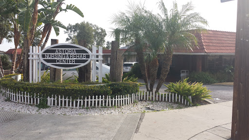 A welcoming entrance to a resort featuring palm trees and well-maintained landscaping.