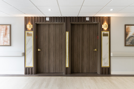 Elevator doors in a modern interior hallway.