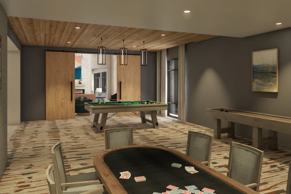 A modern game room featuring a poker and pool table under warm indoor lighting.