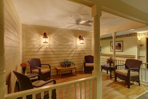 A cozy seating area featuring comfortable chairs and warm lighting, perfect for relaxation.