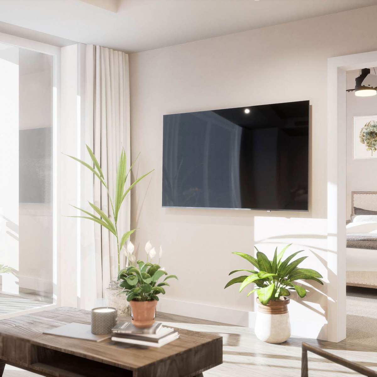 A modern, minimalist living room with a wall-mounted TV and lush green plants.