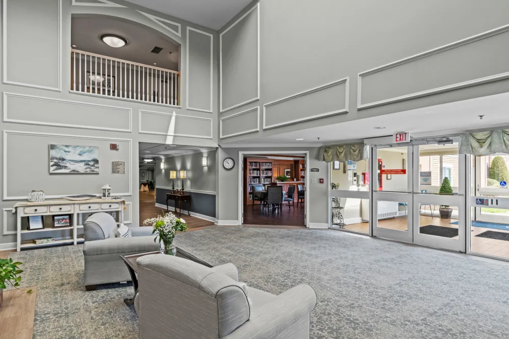 A spacious and well-decorated lobby with comfortable seating and elegant design elements.