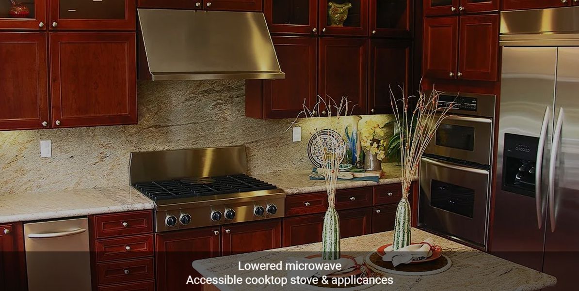 Modern kitchen with accessible features including a lowered microwave and accessible cooktop stove and appliances.
