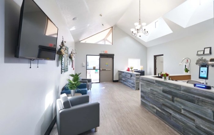A modern reception area with minimalist decor and comfortable seating.