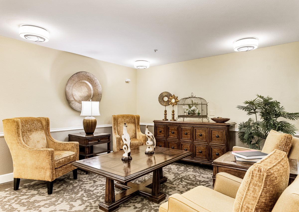 A traditional living room with elegant furniture and decorative accents.