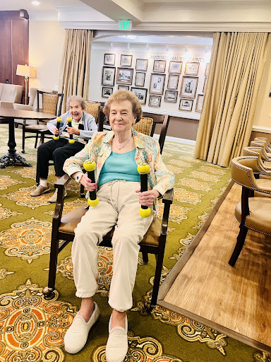 A joyful afternoon in the lounge with drinks, celebrating life's moments.
