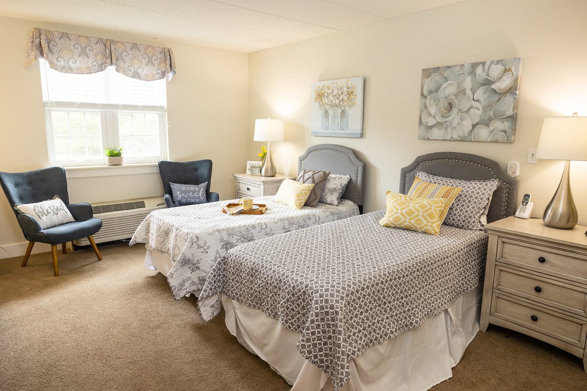 A cozy bedroom with twin beds and stylish decor.