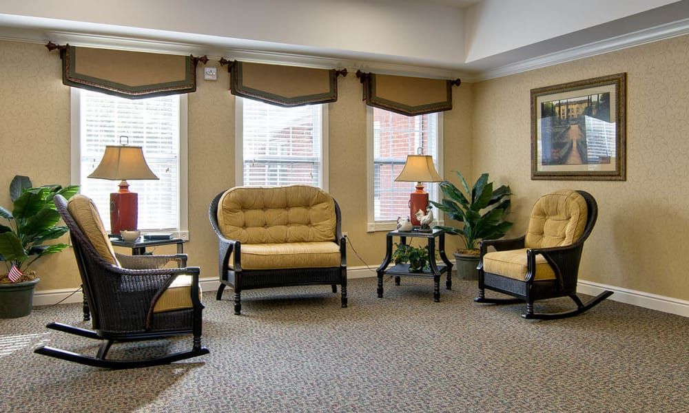 A cozy and elegantly decorated living room with comfortable seating and ambient lighting.