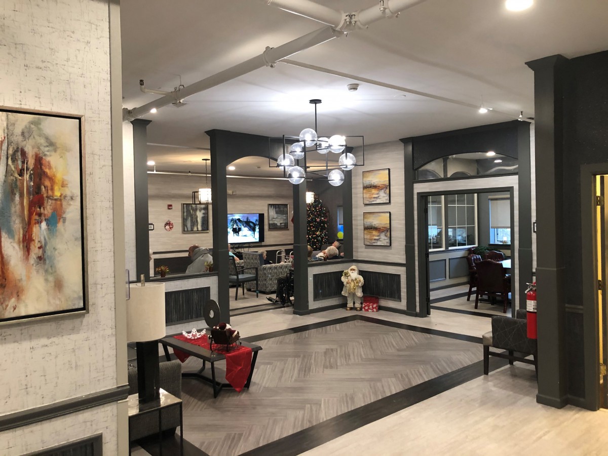 A spacious and elegantly decorated lobby area with modern furnishings and lighting.