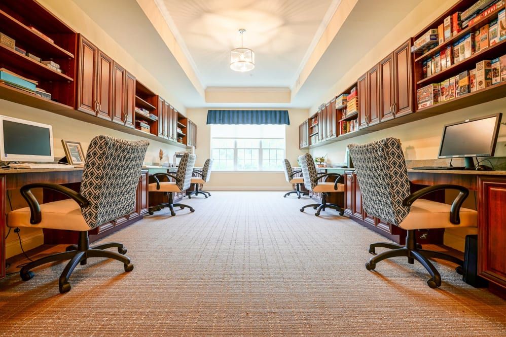 A modern and well-organized open office space with multiple workstations.