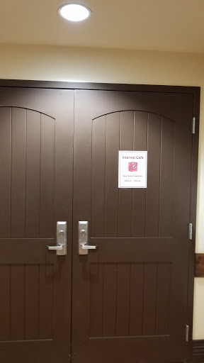 Double doors with a notice sign attached.