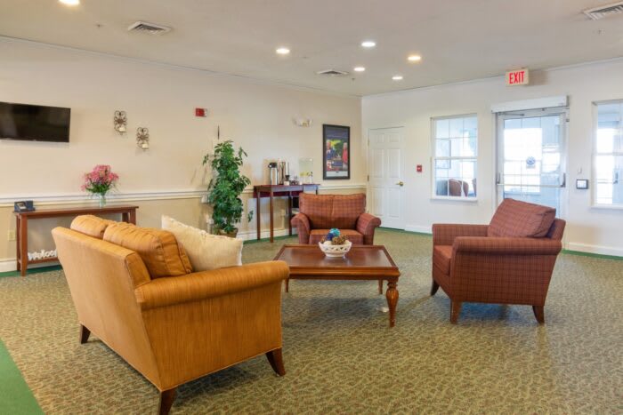 A cozy lobby area with comfortable seating and elegant decor.