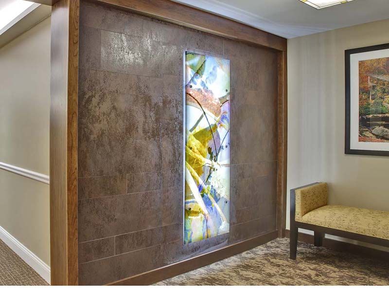 A modern interior space featuring an abstract wall art installation with vibrant colors.