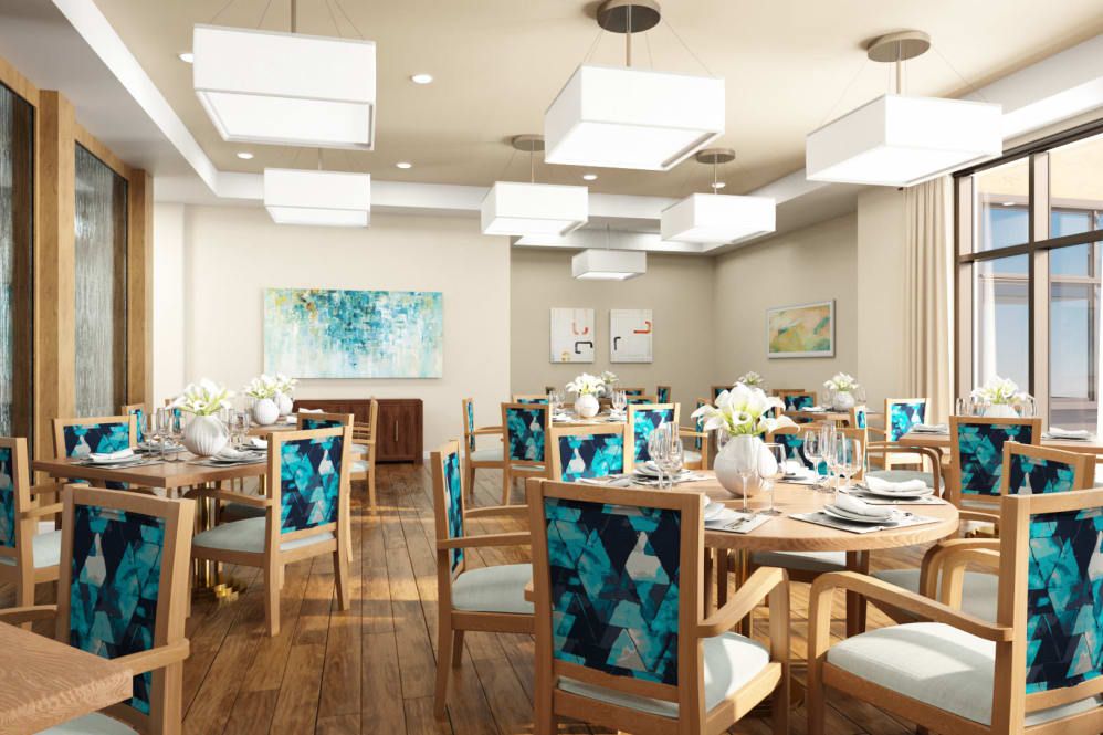 A modern dining room with stylish furniture, decorative artwork, and elegant lighting.