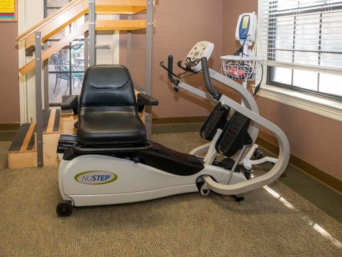 A recumbent exercise bike in a gym setting.