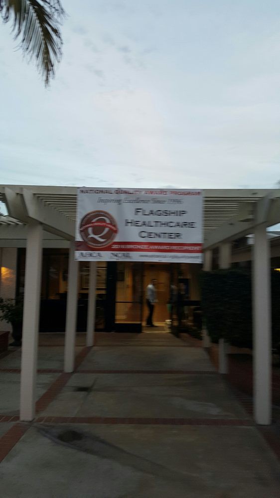 Entrance to a healthcare center with a banner overhead.