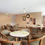A cozy dining area with tables and chairs arranged for seating.