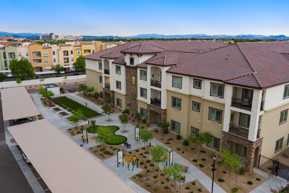 A modern apartment complex with well-maintained landscaping.