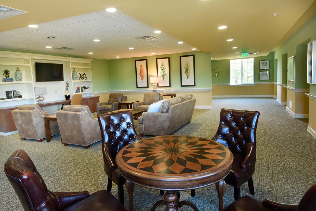 A cozy living room with comfortable seating and a decorative table.