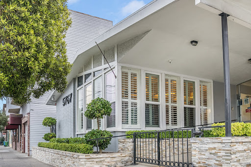 A modern residential home featuring elegant architecture and well-kept landscaping.