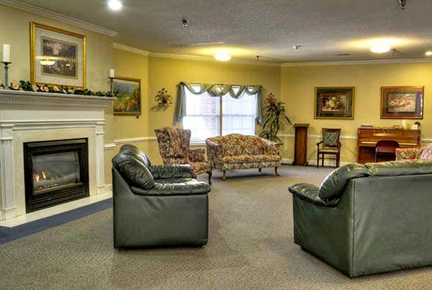 A cozy living room with comfortable seating and a fireplace.