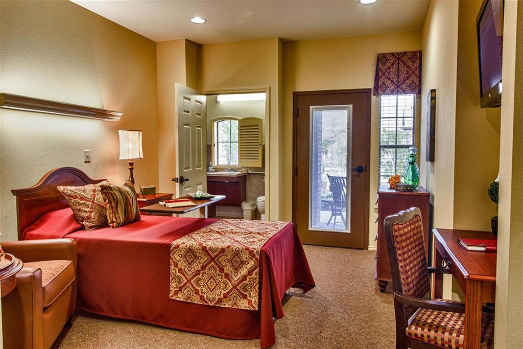 A cozy bedroom with warm lighting and elegant decor.
