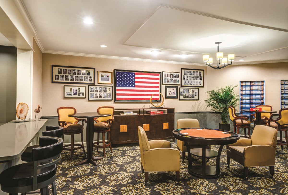 A cozy lounge area featuring an American flag and stylish seating arrangements.