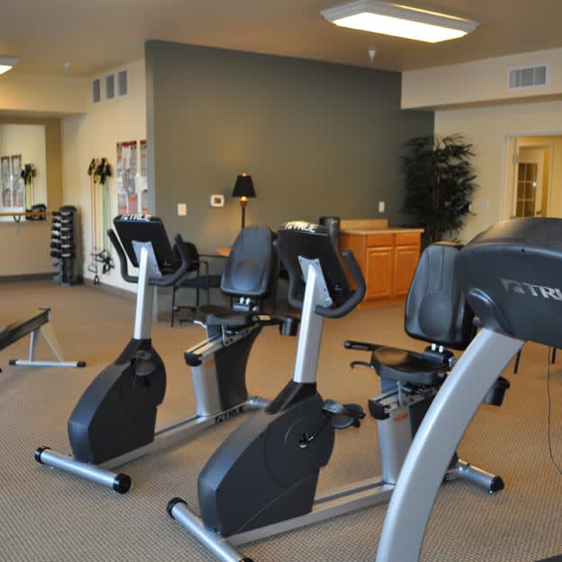A gym with exercise bikes and various fitness equipment.