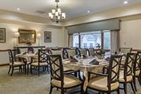 A well-appointed dining area with neatly arranged tables and elegant lighting.